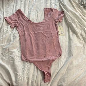 Pink eye candy body suit